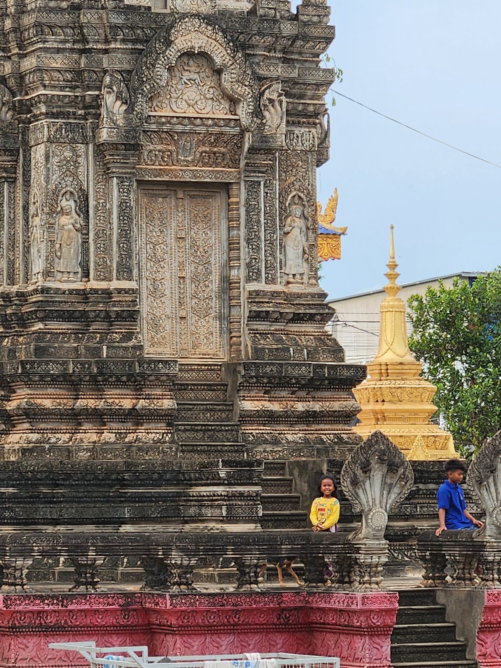 Intricate bas-relief carvings frame the stone gateway