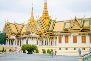 Stunning view of the Royal Palace in Phnom Penh, Cambodia with intricate golden spires.