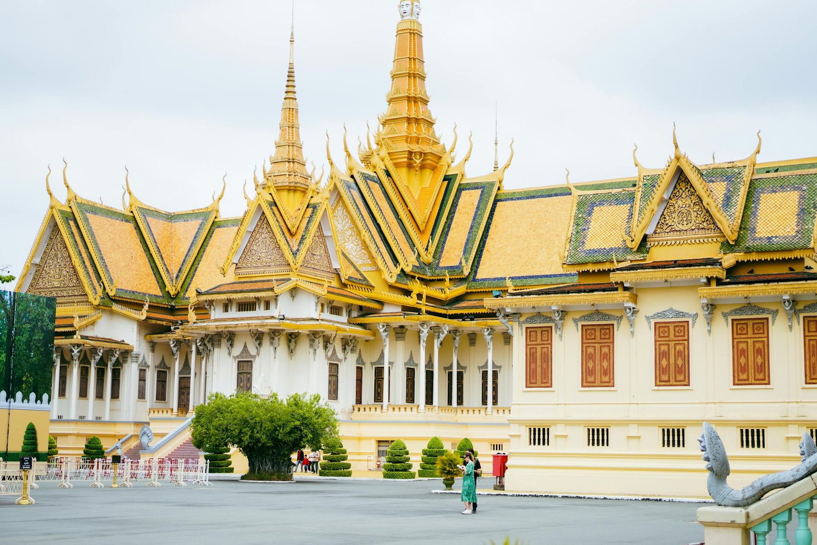 Stunning view of the Royal Palace in Phnom Penh, Cambodia with intricate golden spires.