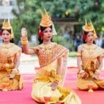 Apsara dancers performing traditional Khmer dance in golden costumes