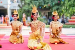 Apsara dancers performing traditional Khmer dance in golden costumes
