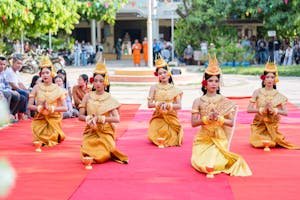 Five women in traditional Cambodian attire perform a cultural dance in Battambang Province.